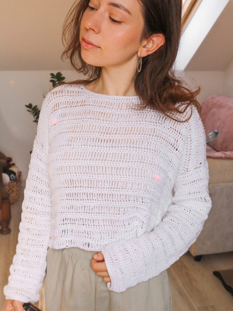 Lightweight open-stitch texture of the Cove crochet sweater