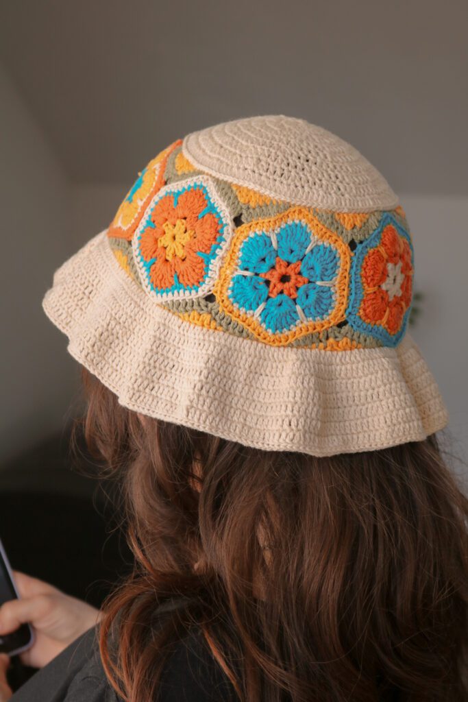 Retro crochet sun hat with flared brim and floral hexagons — scrap yarn crochet pattern